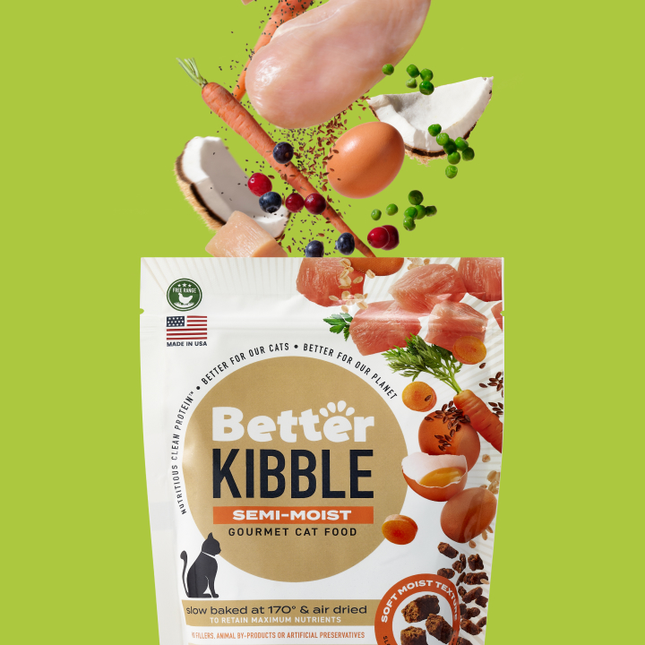 http://Better%20kibble%20for%20cat%20bag%20with%20ingredients%20coming%20out